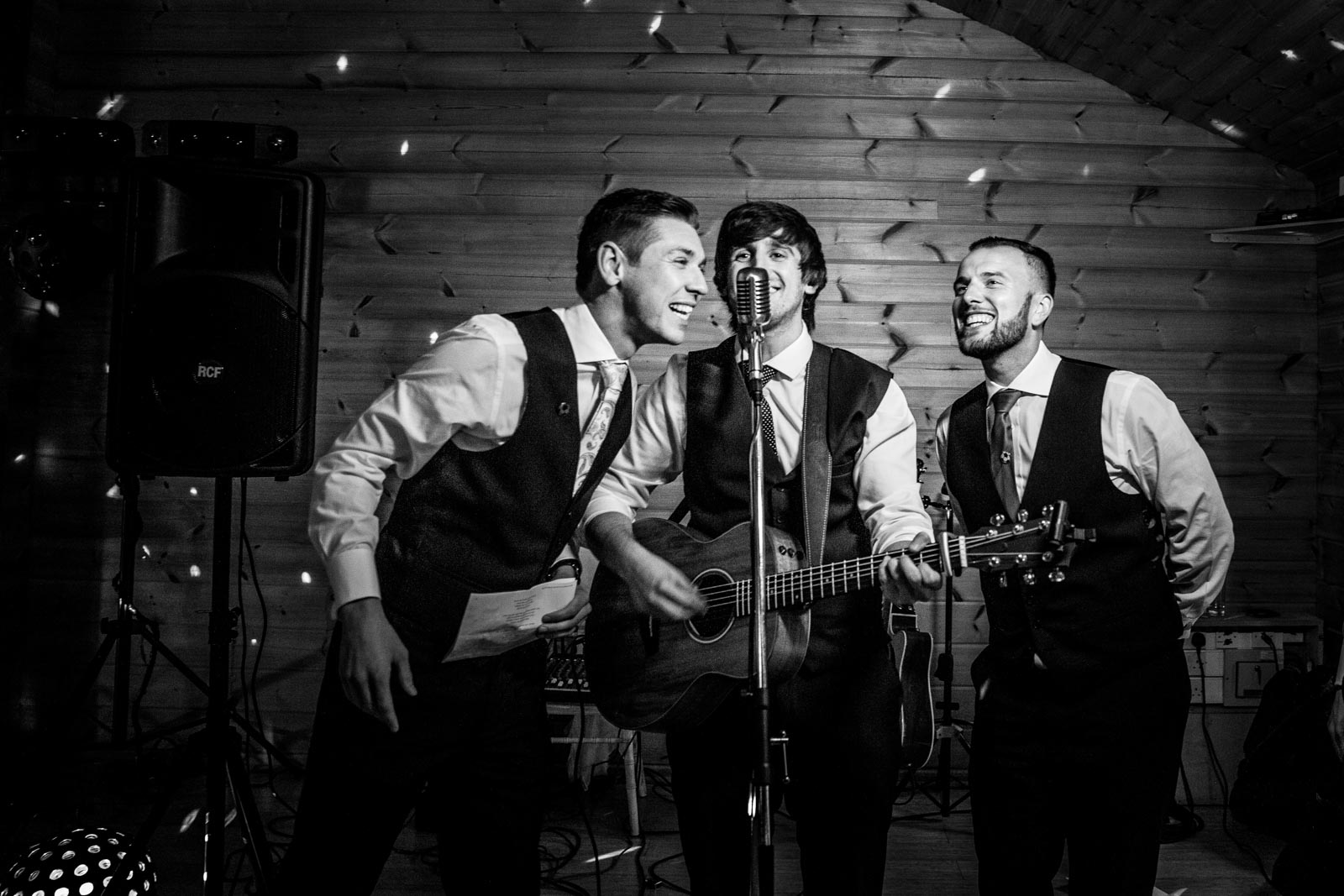 groomsmen singing during the reception at styal lodge wedding venue