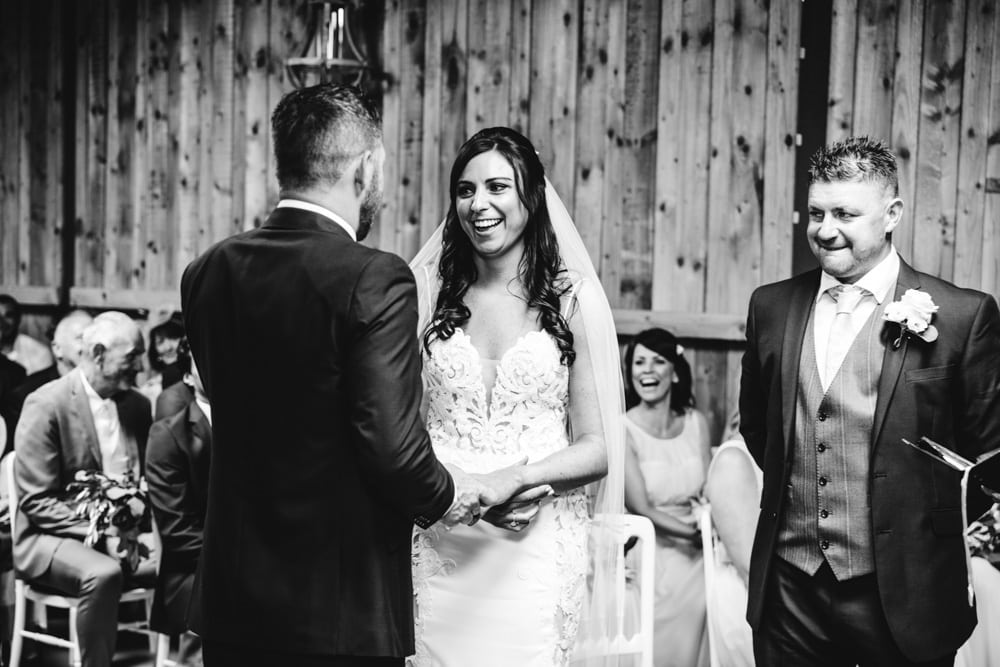 dove barn wedding ceremony with bride and groom