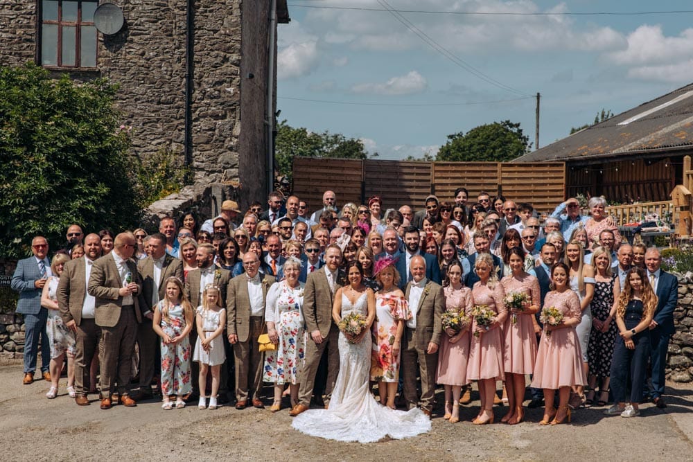 group wedding photos of bride and groom and wedding guests at park house farm