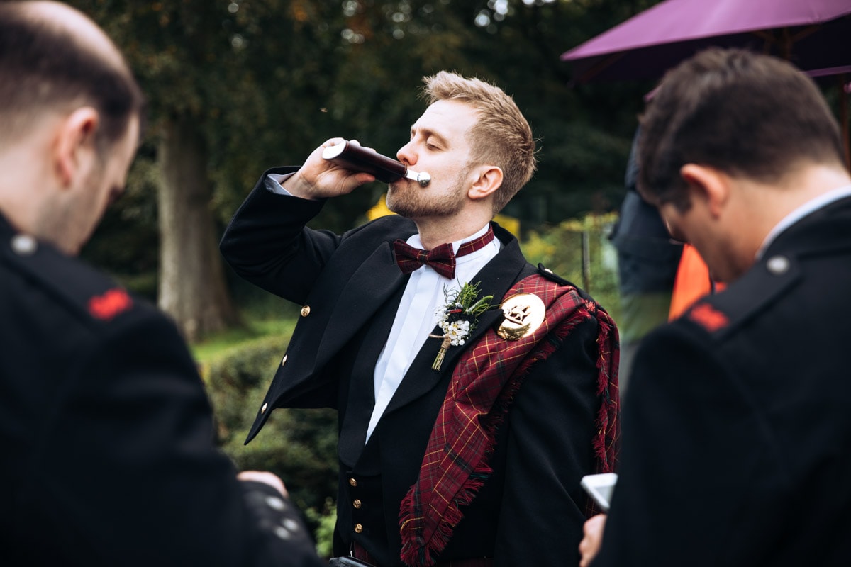 groom and his hit flask