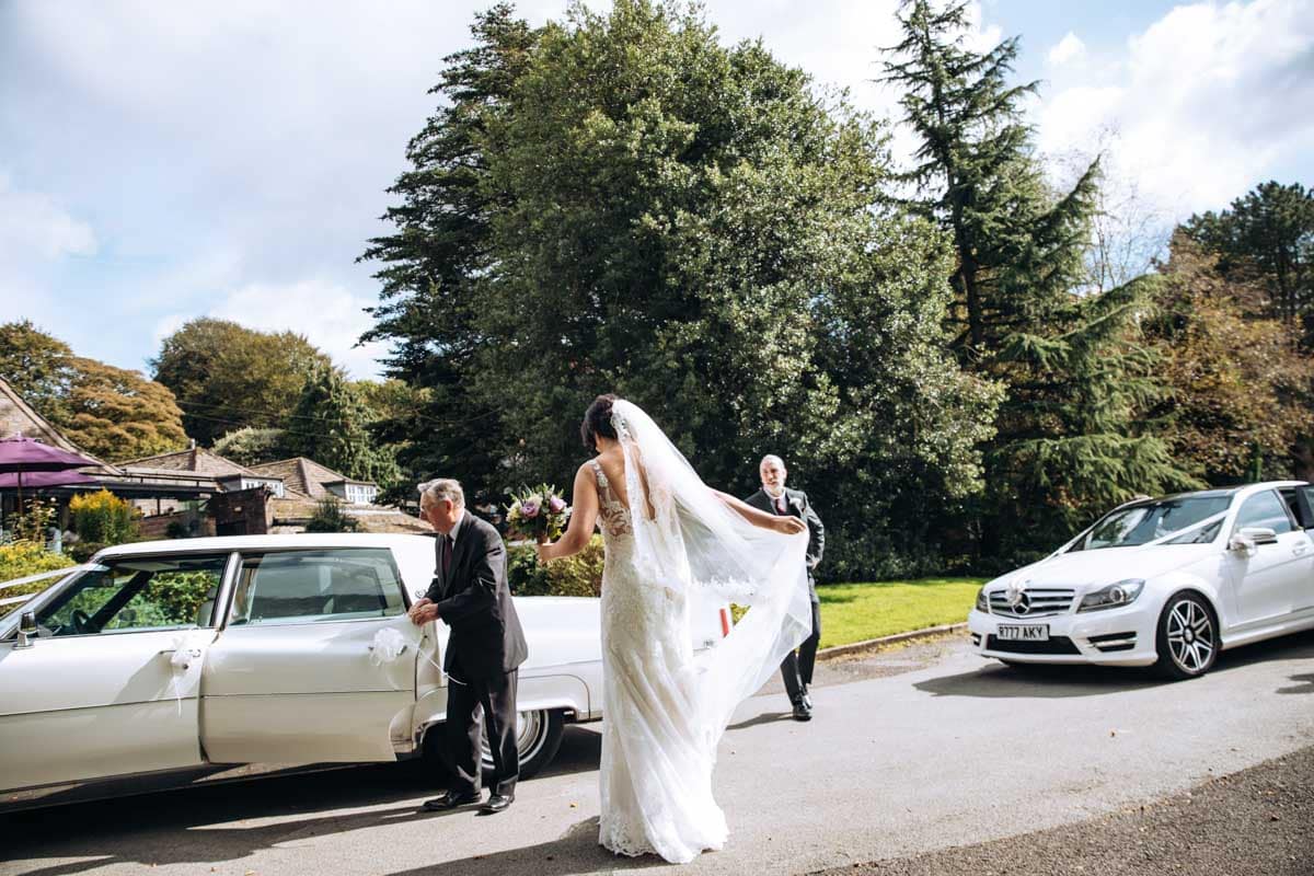 bride arriving at rivington barn in bolton