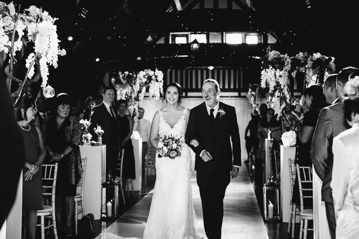 walking down the aisle at rivington barn