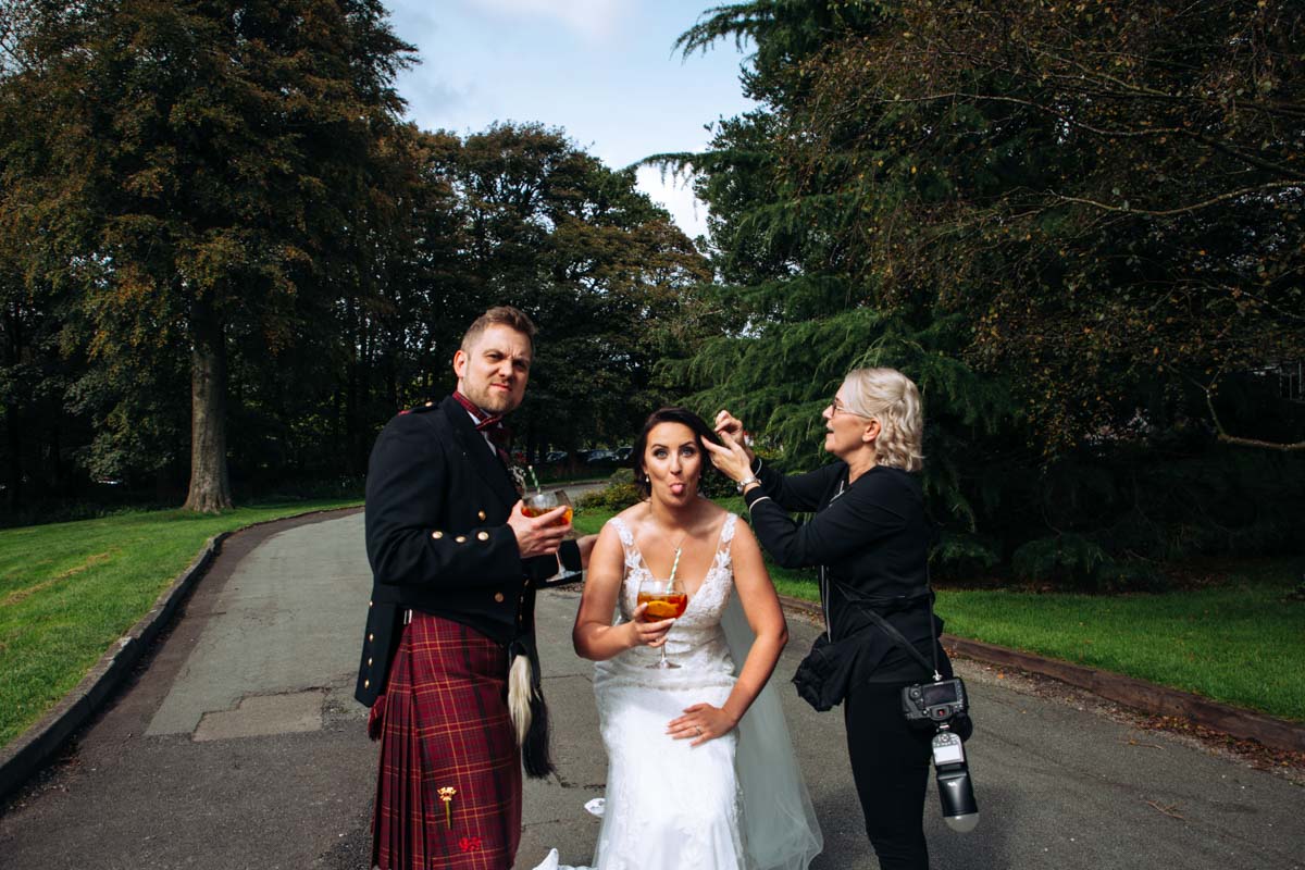 photographer with bride at rivington barn