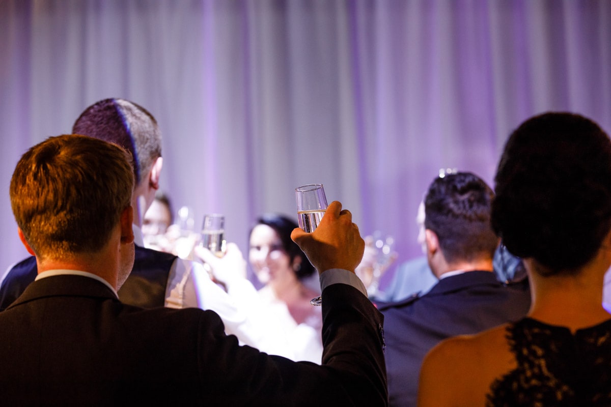 raising a glass at a wedding