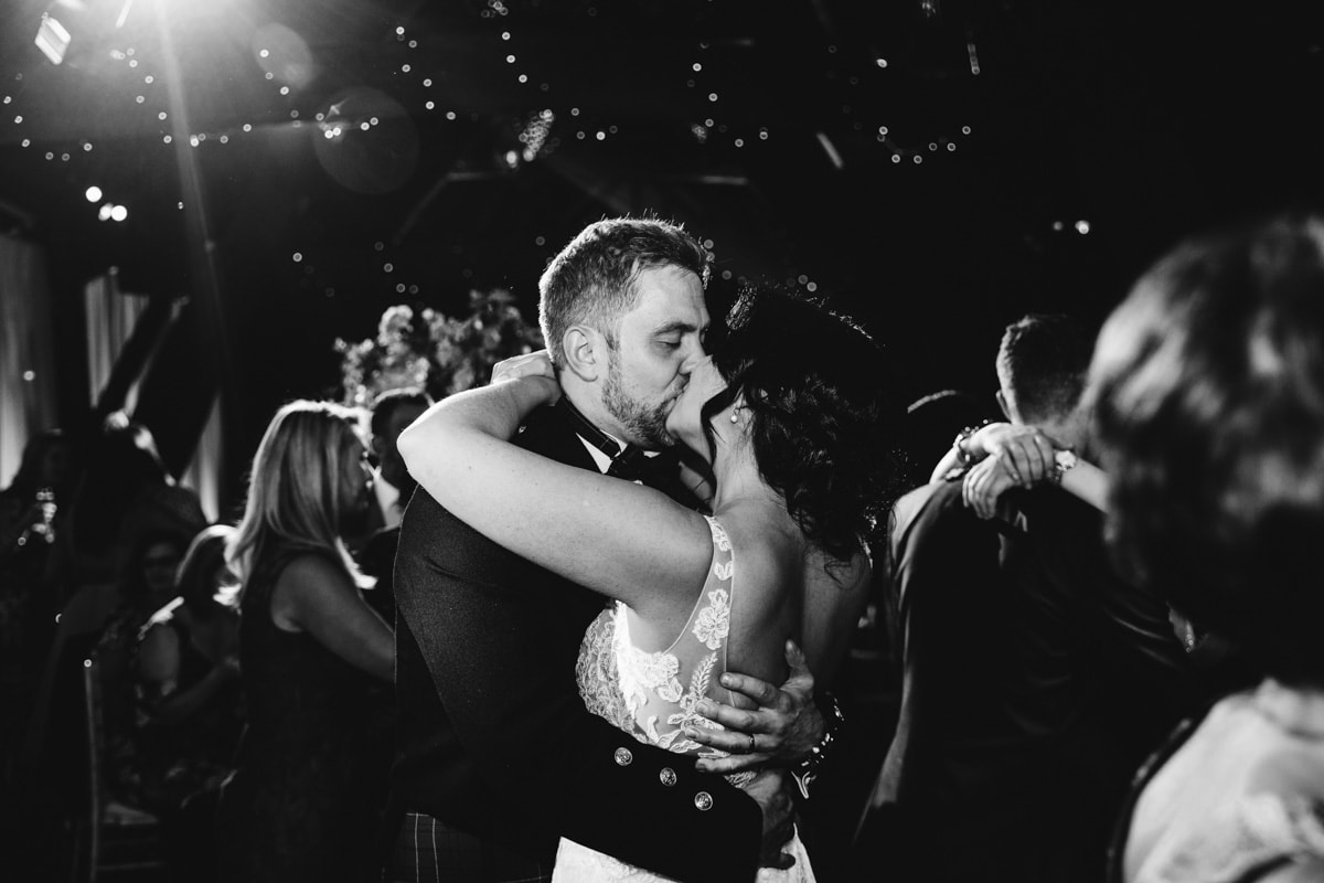 bride and groom kiss