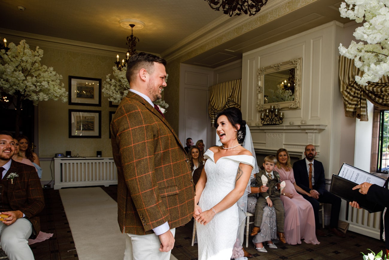 bride laughing during ceremony