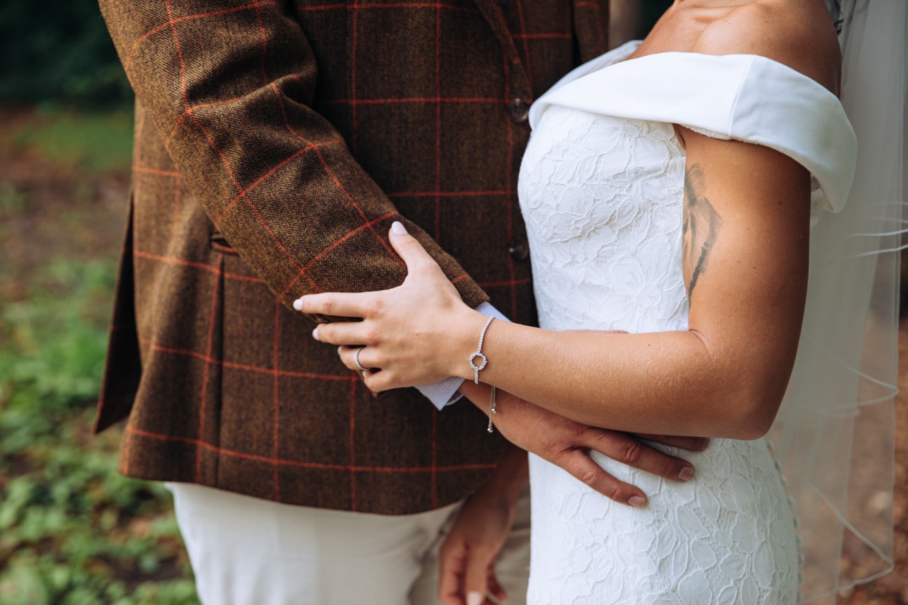 bride and groom embrace