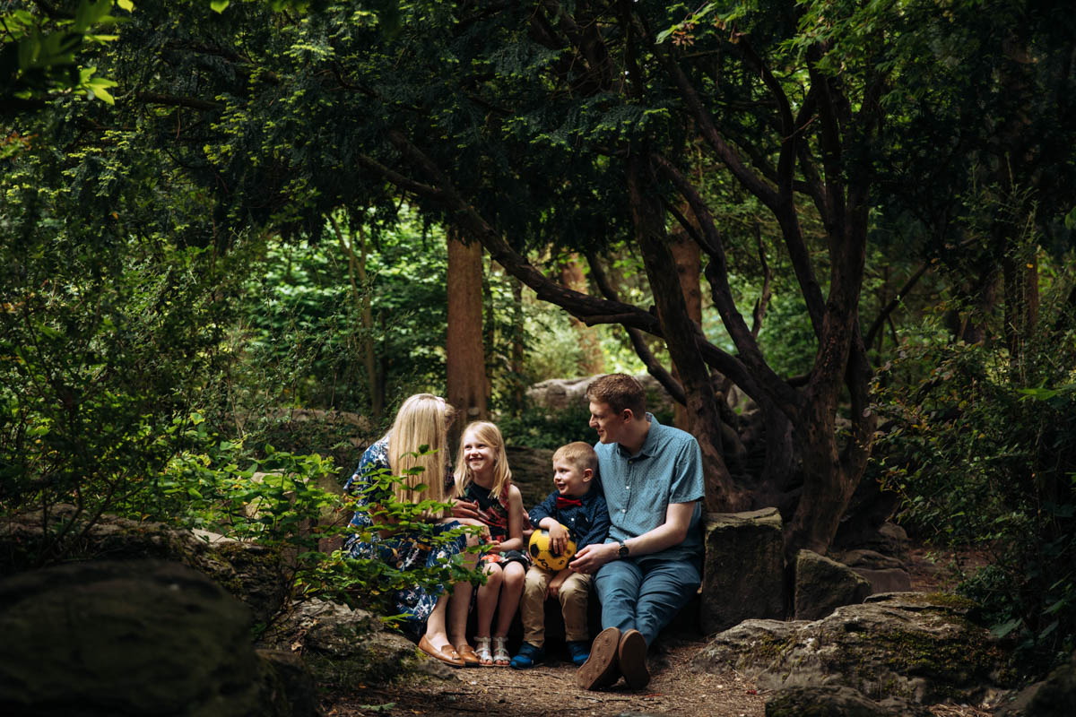 family portrait in a wooded area