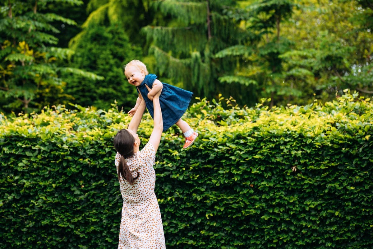 Mum throws daughter in air