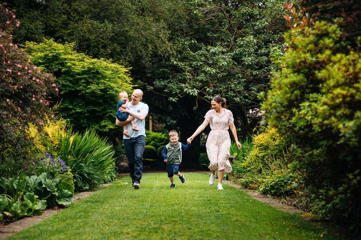 Family running in gardens