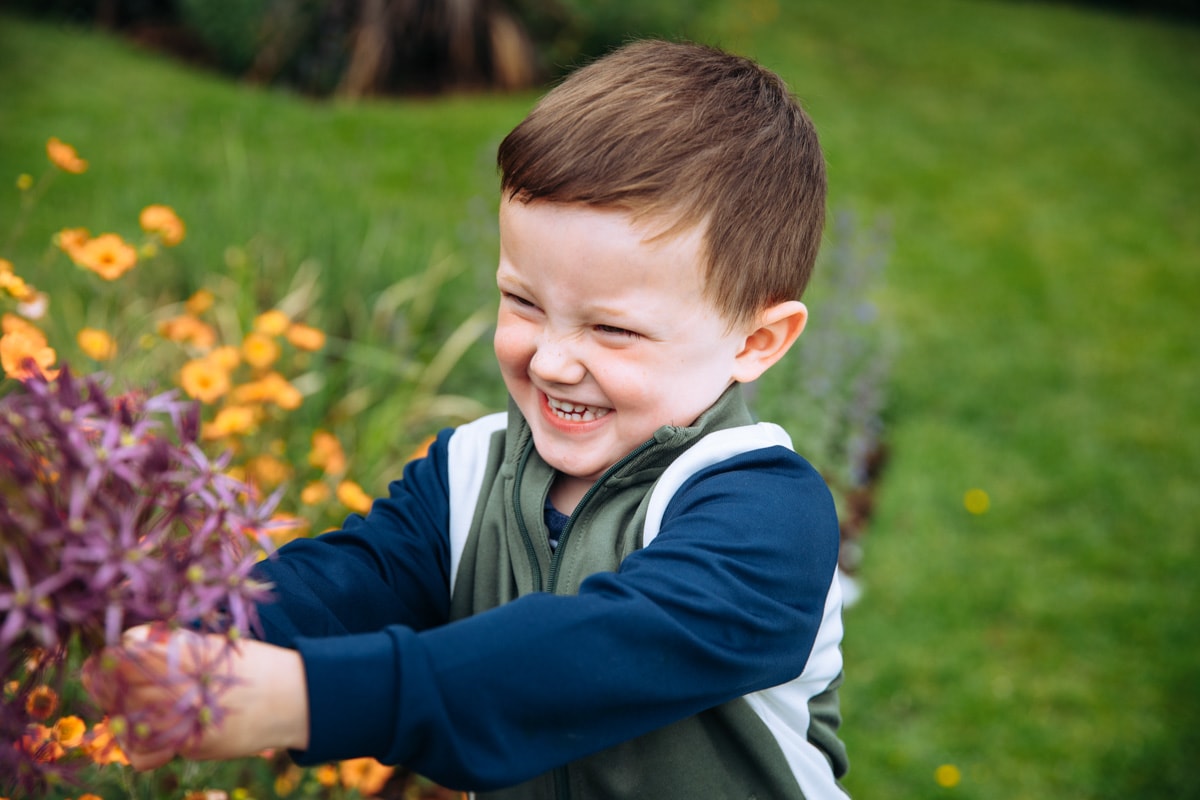 boy holding flower