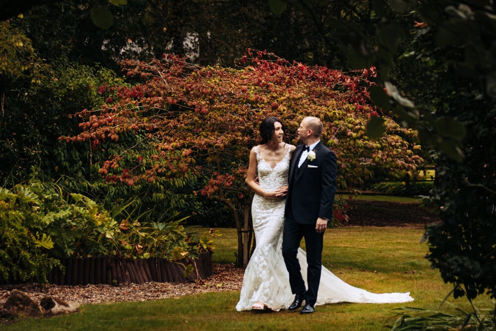 Nunsmere Hall Wedding Photography Abby and Guido walk around the grounds at Nunsmere Hall on their wedding day