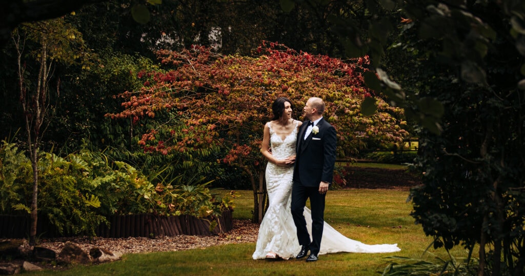 Nunsmere Hall Wedding Photography Abby and Guido walk around the grounds at Nunsmere Hall on their wedding day