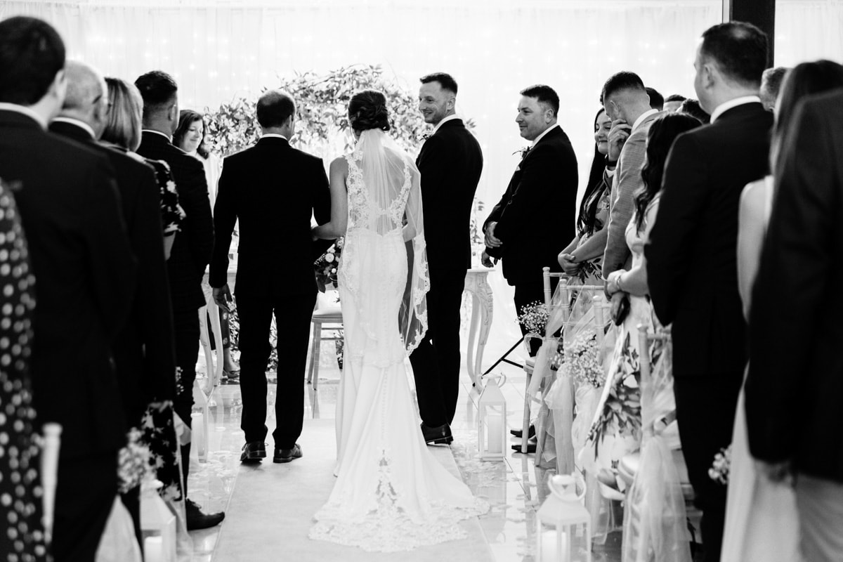 Bride walking down the aisle at the new stirk house cheshire