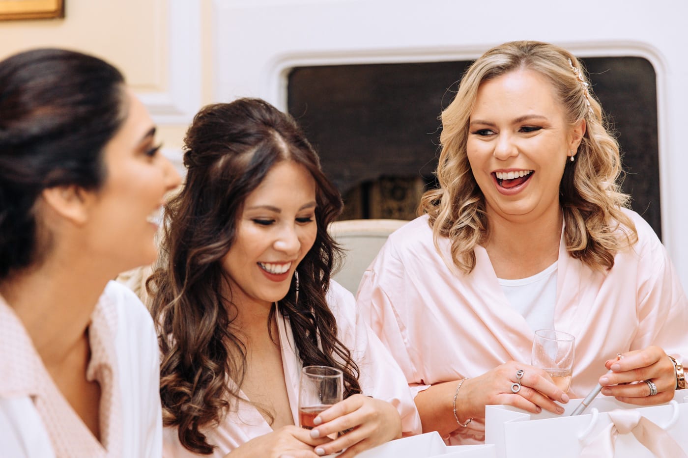 bridesmaids chatting during bridal prep at eshott hall wedding venue in northumberland