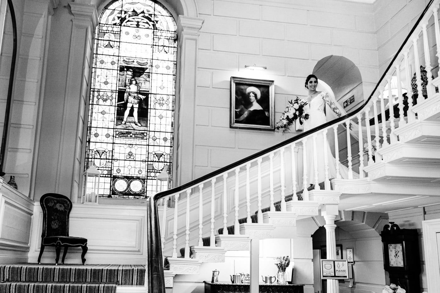 bride coming down the stairs at eshott hall