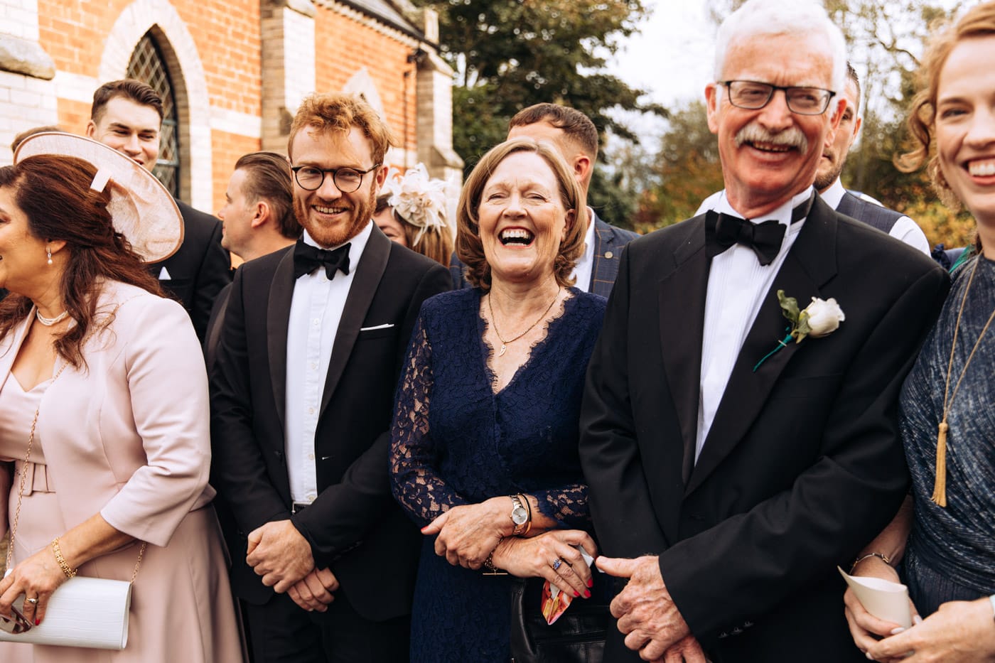 confetti outside the chapel at eshott hall wedding photography