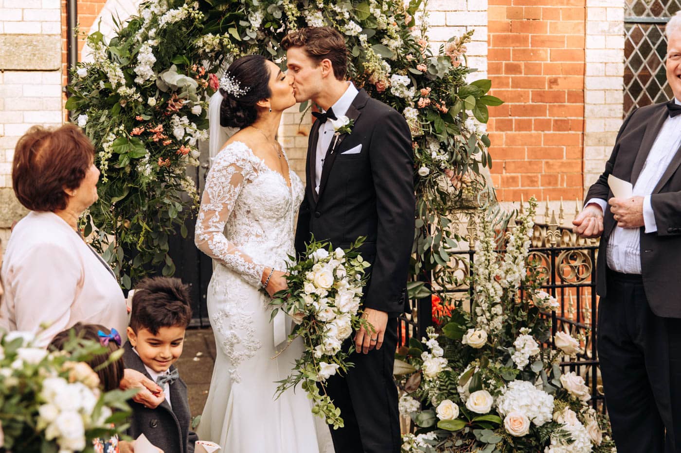 confetti outside the chapel at eshott hall wedding photography