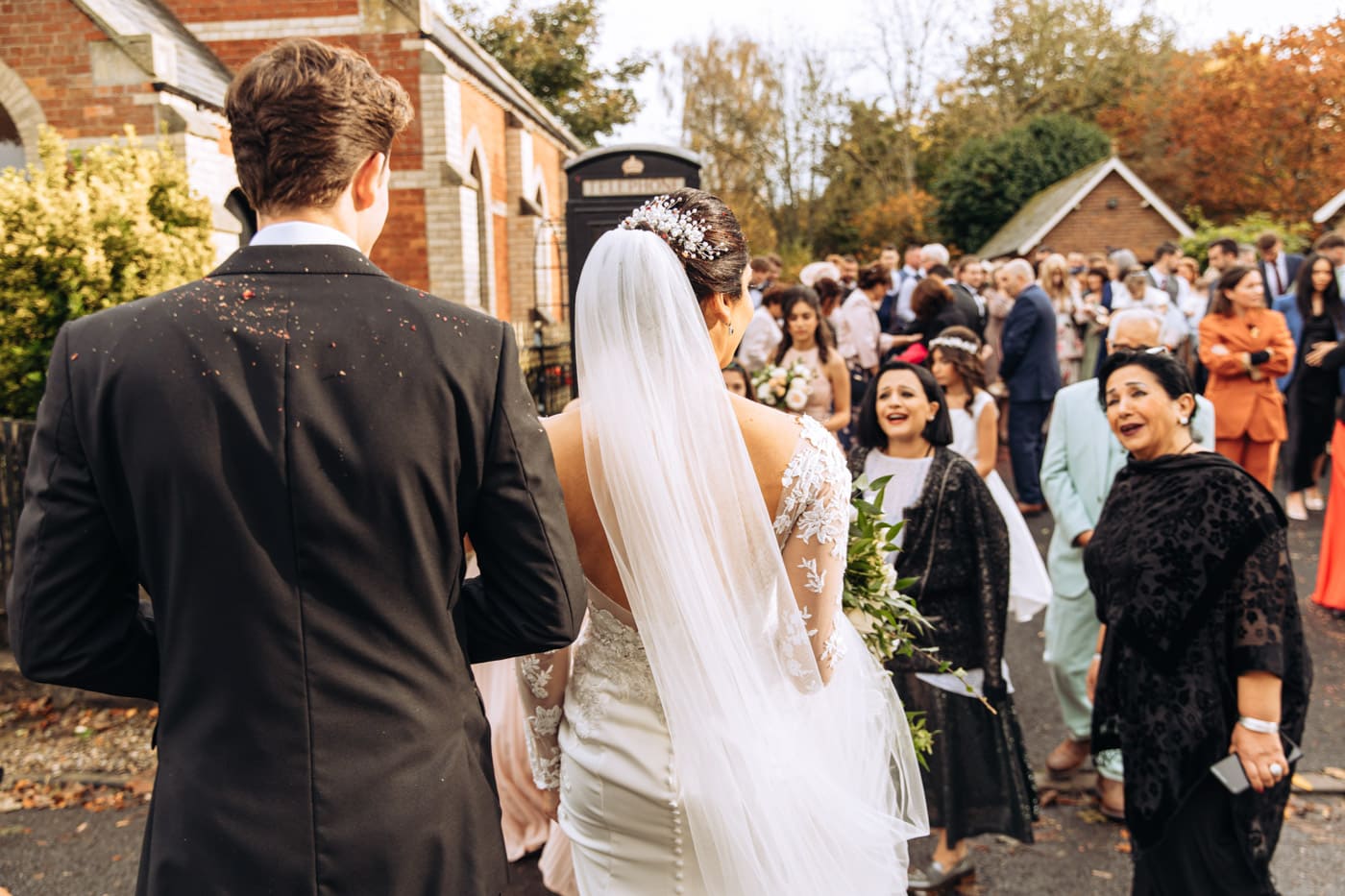 confetti outside the chapel at eshott hall wedding photography