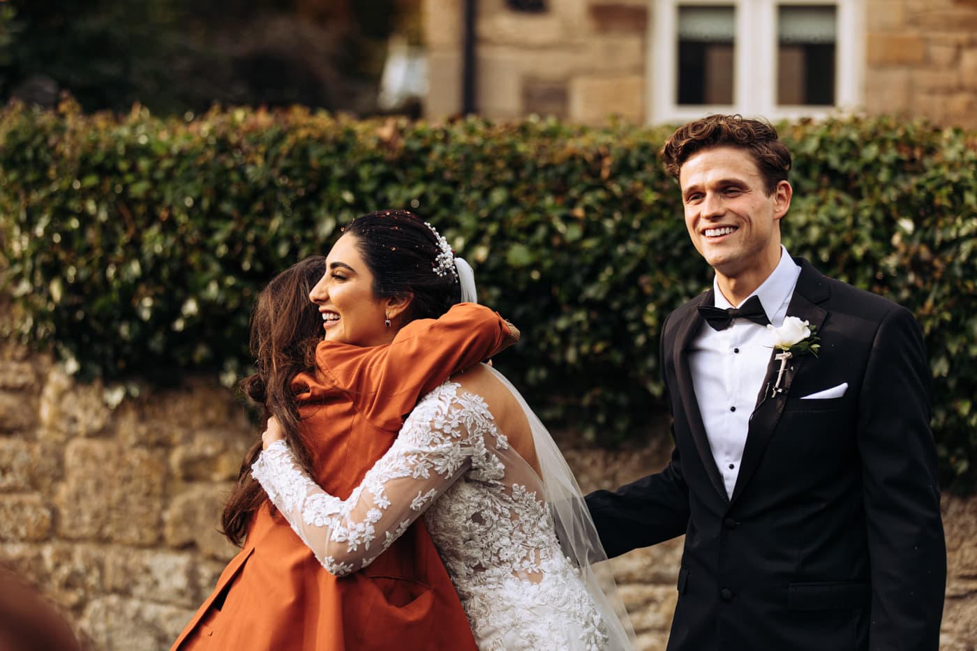 confetti outside the chapel at eshott hall wedding photography