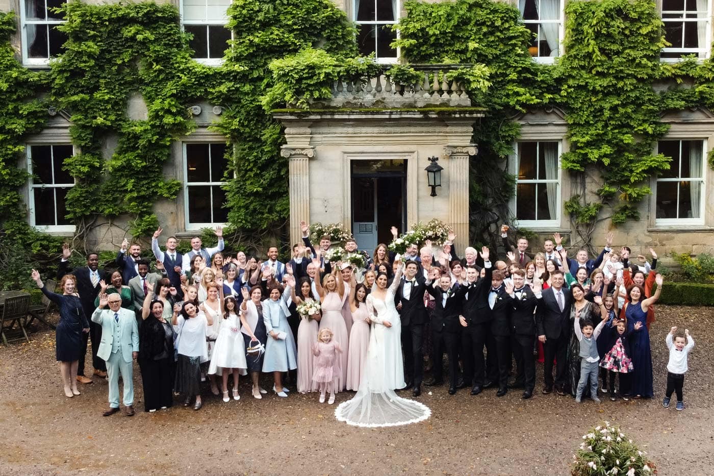 bridal party group photographs at eshott hall during their wedding day photography