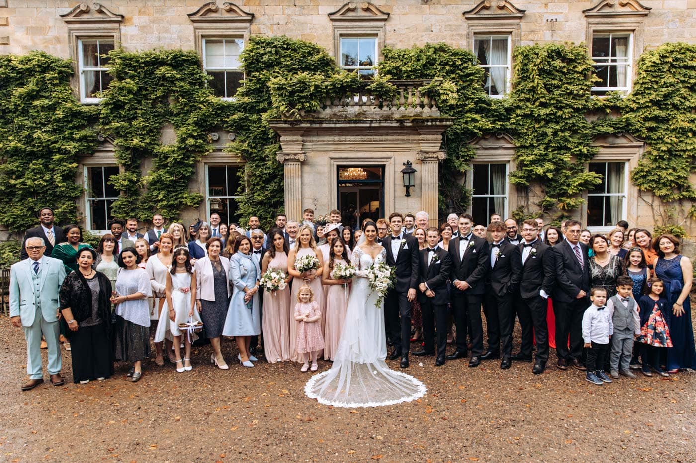 bridal party group photographs at eshott hall during their wedding day photography
