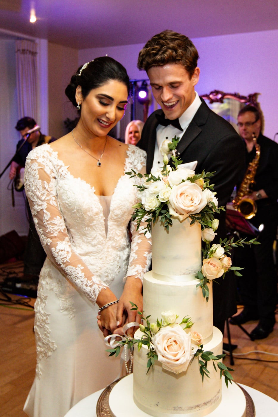 cake cut at eshott hall wedding venue