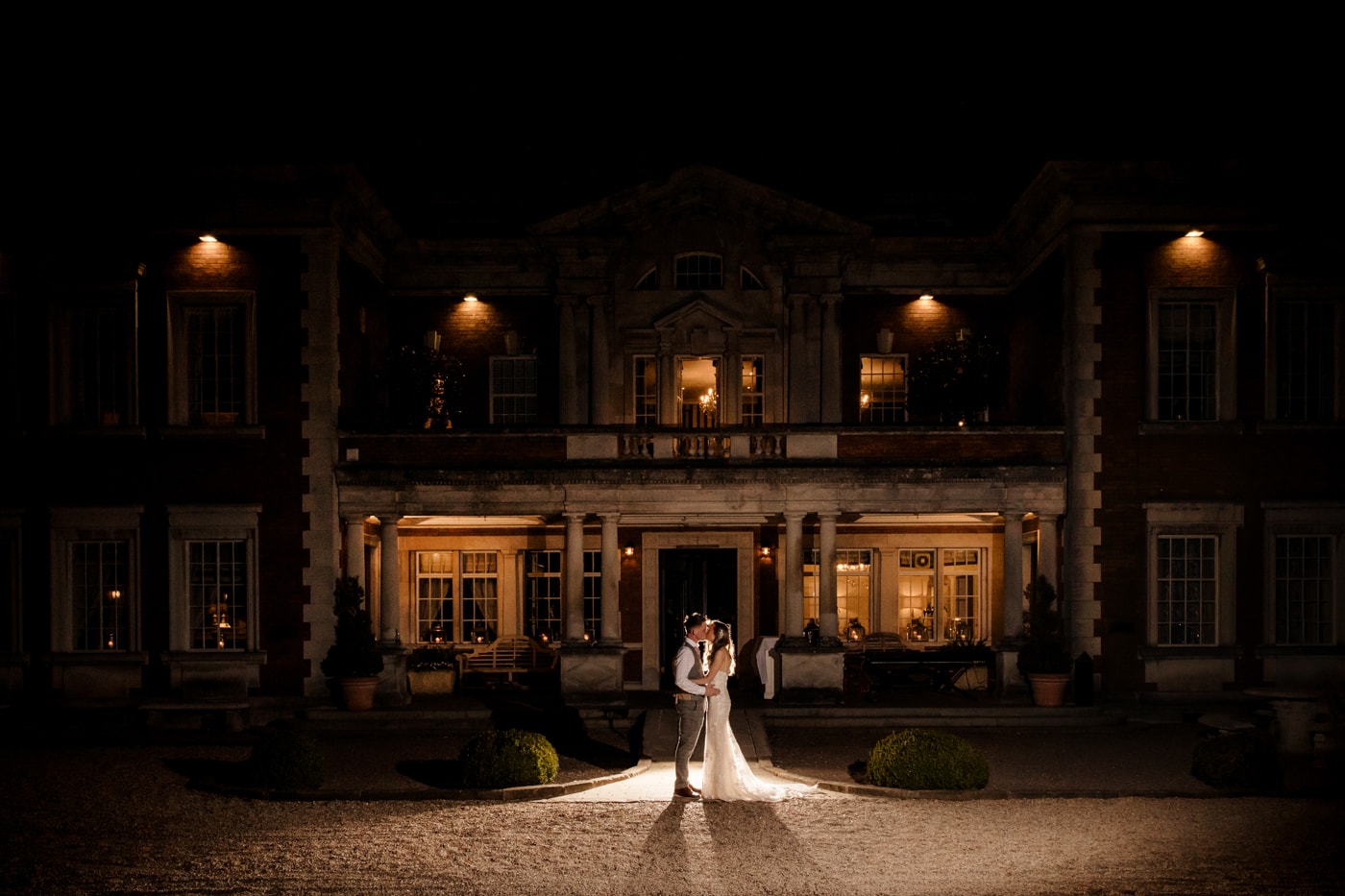 Lauren and patrick at Eaves Hall in cheshire outside for their evening photograph outside the historic manor house