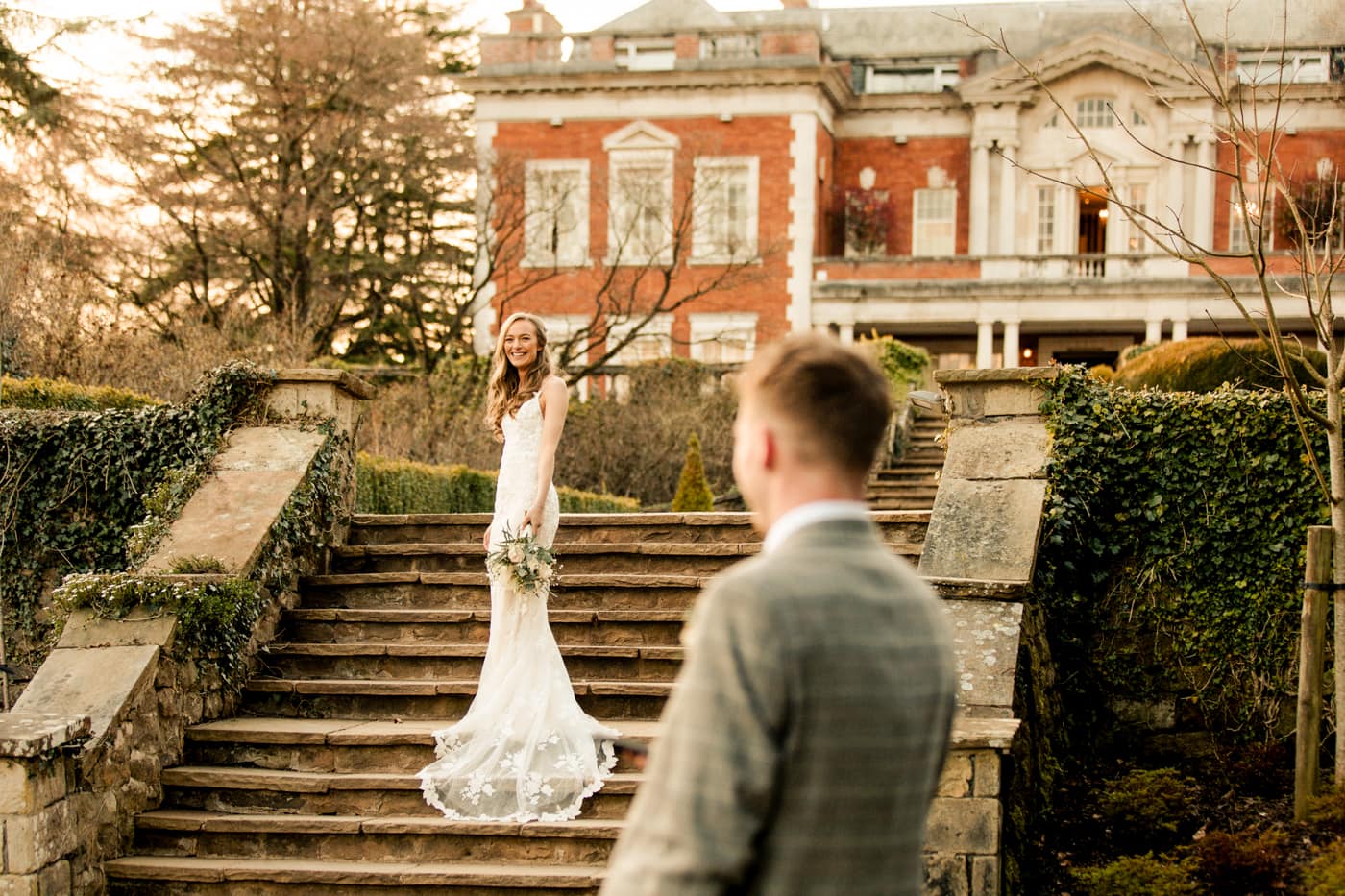 Lauren & Patrick having their portraits took at eaves hall in the gardens