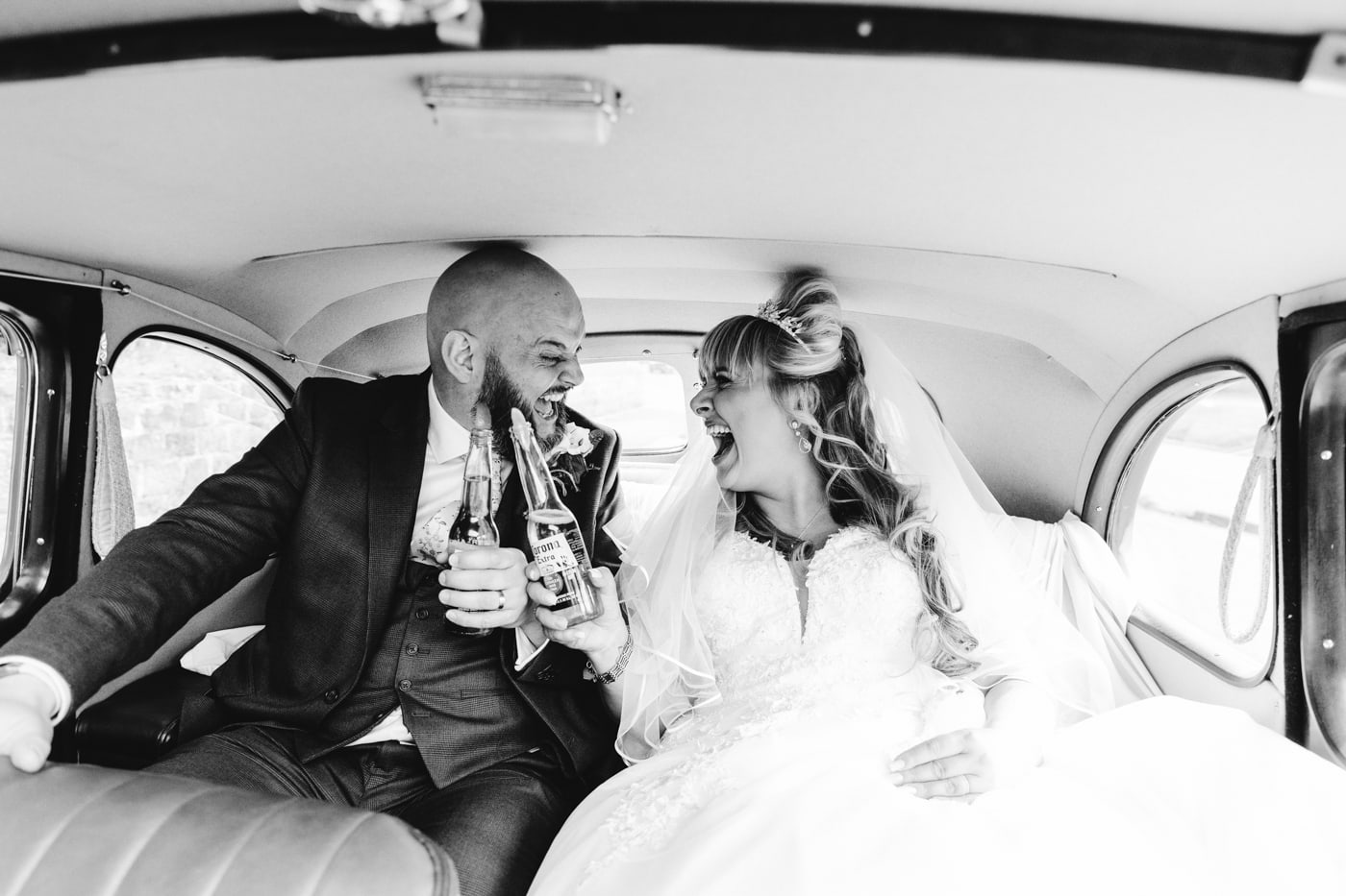 bride and groom in their wedding car worsley wedding photographer