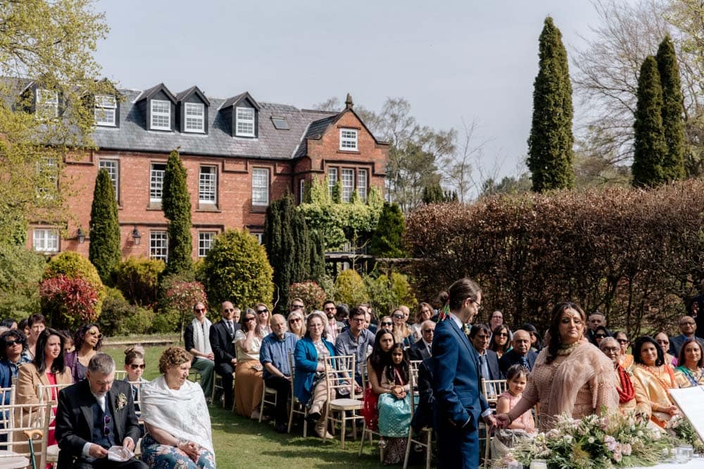 outdoor wedding ceremony at nunsmere hall cheshire for shiv and toby