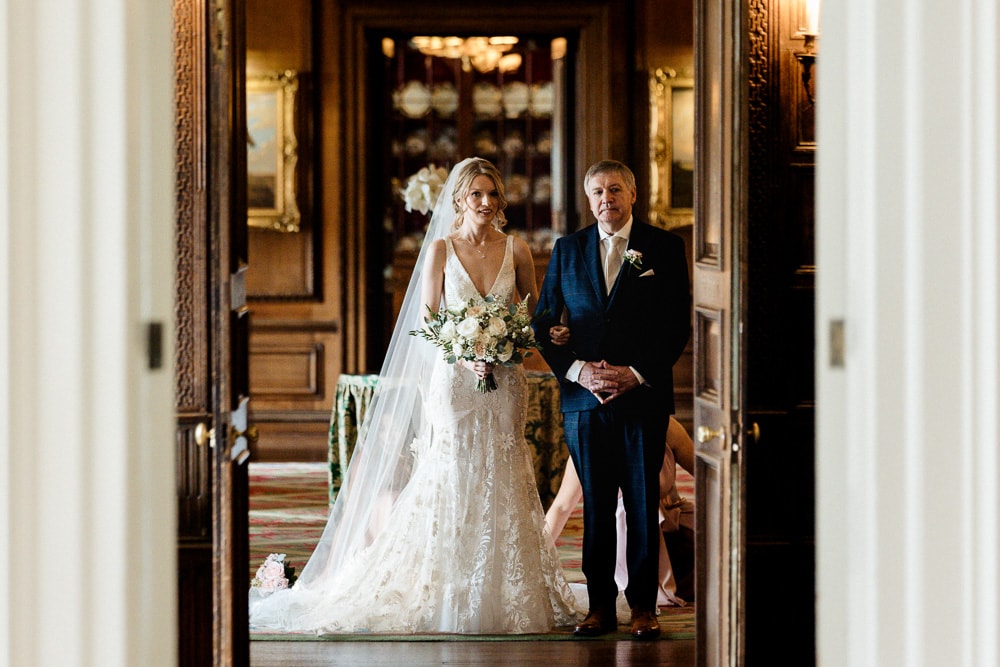bride walking down the wedding aisle at knowsley hall