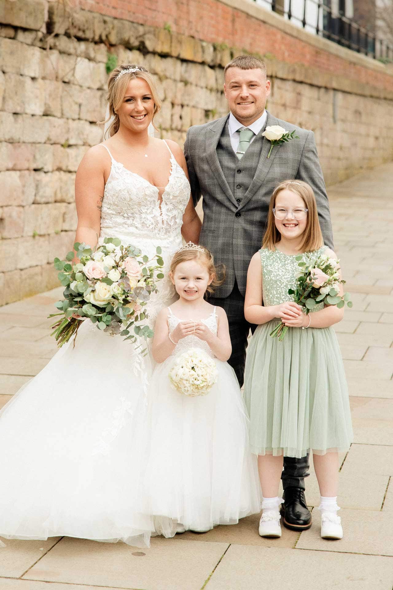 outside the castlefield rooms wedding venue guests gather for group photos