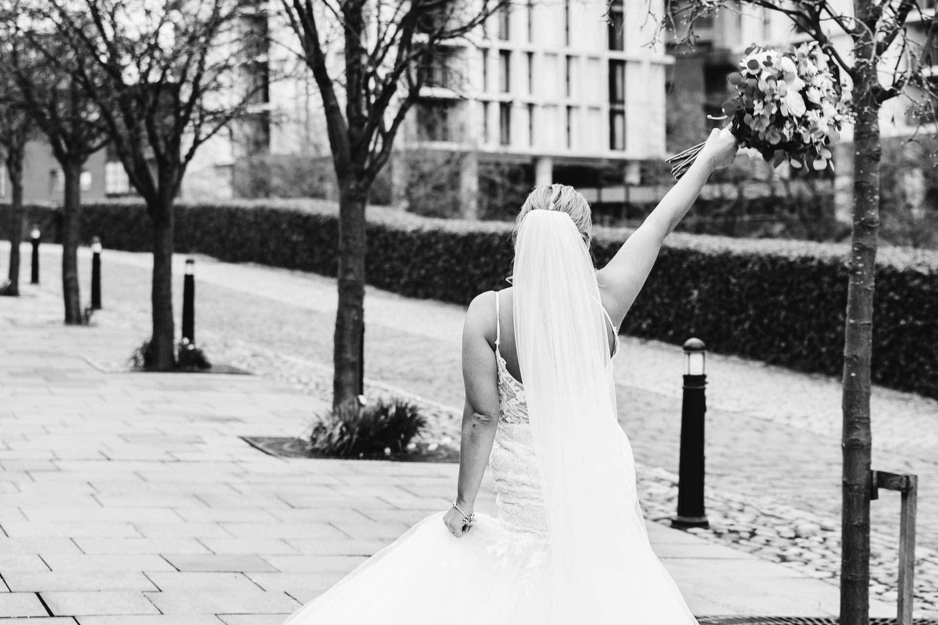 outside the castlefield rooms wedding venue guests gather for group photos