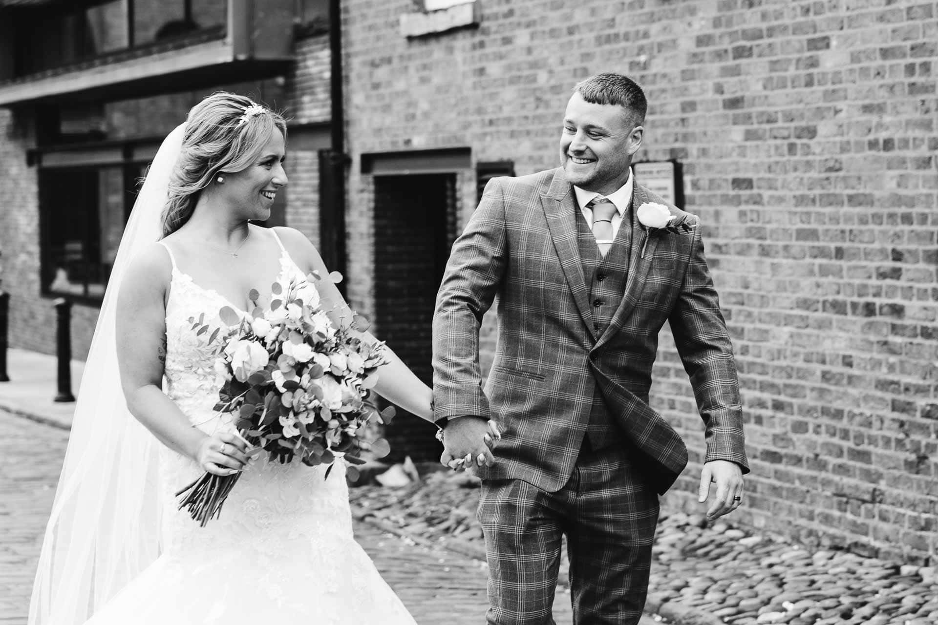 outside the castlefield rooms wedding venue guests gather for group photos