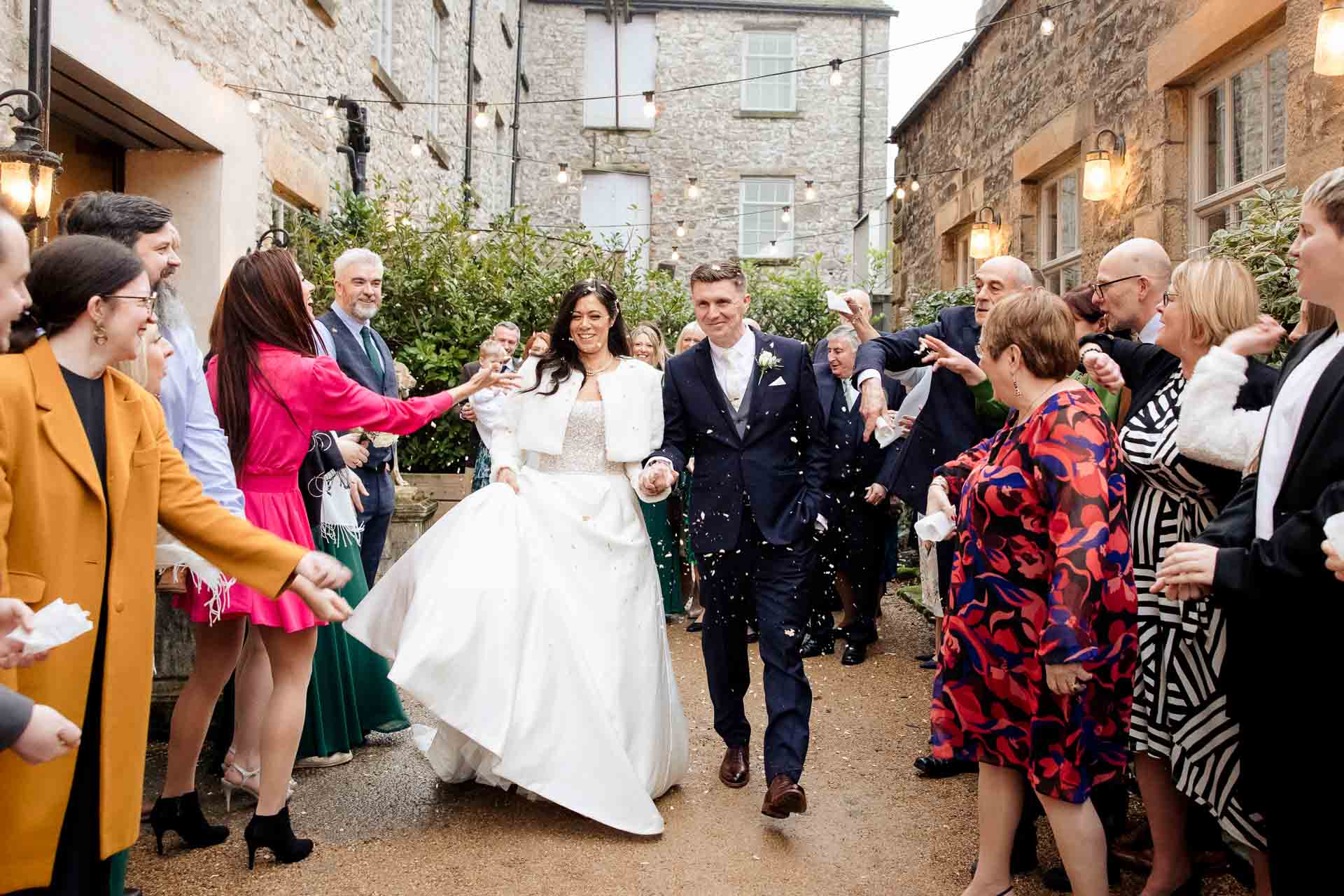confetti with bride and groom at holmes mill