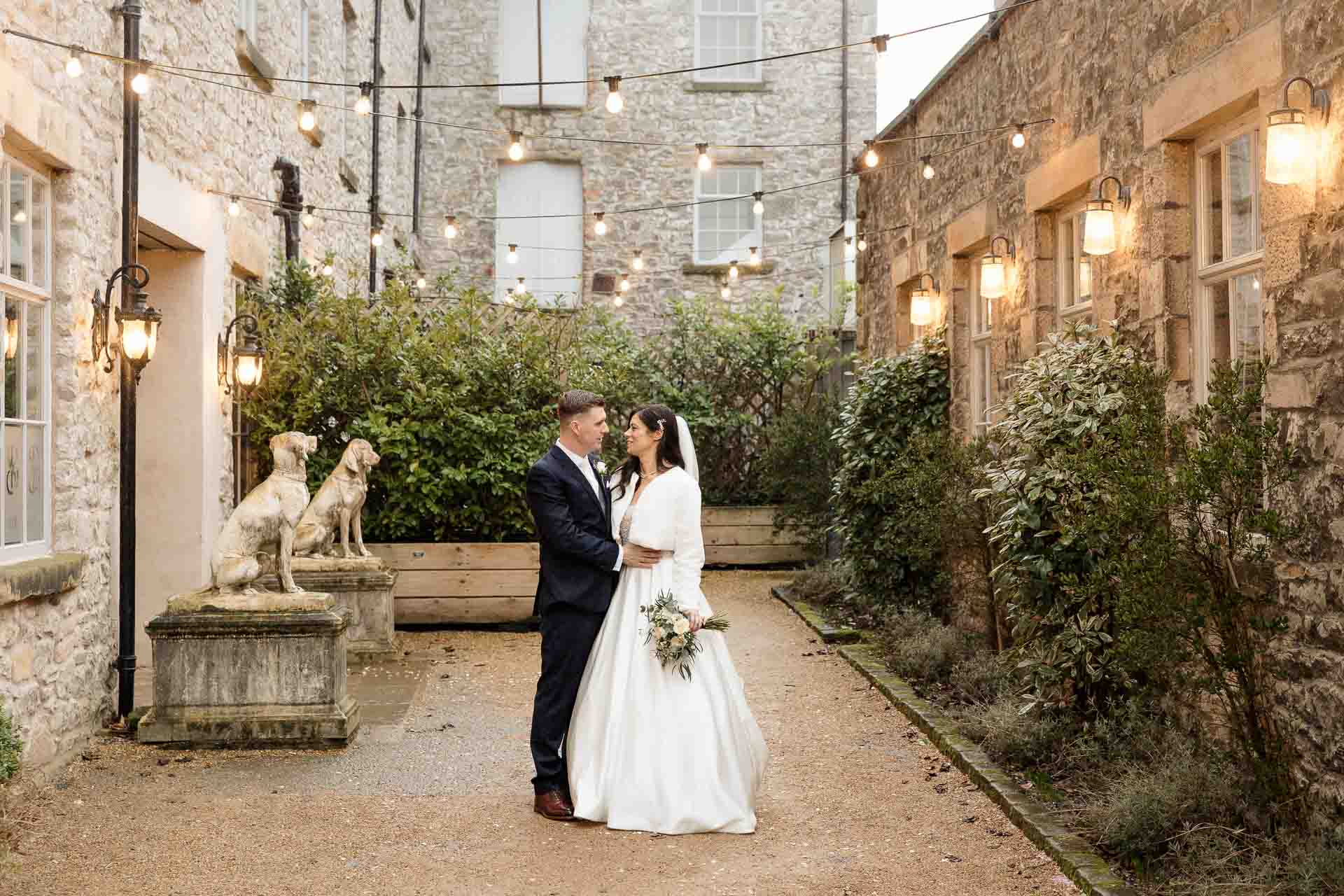 confetti with bride and groom at holmes mill