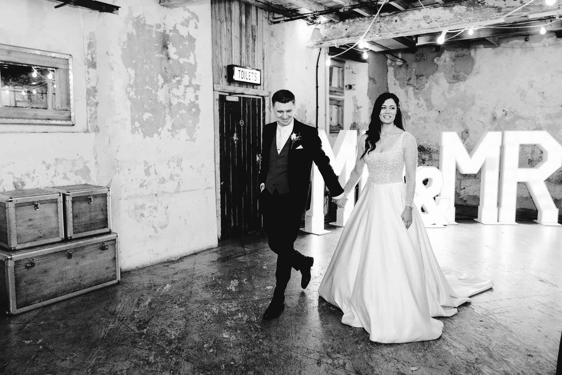 confetti with bride and groom at holmes mill