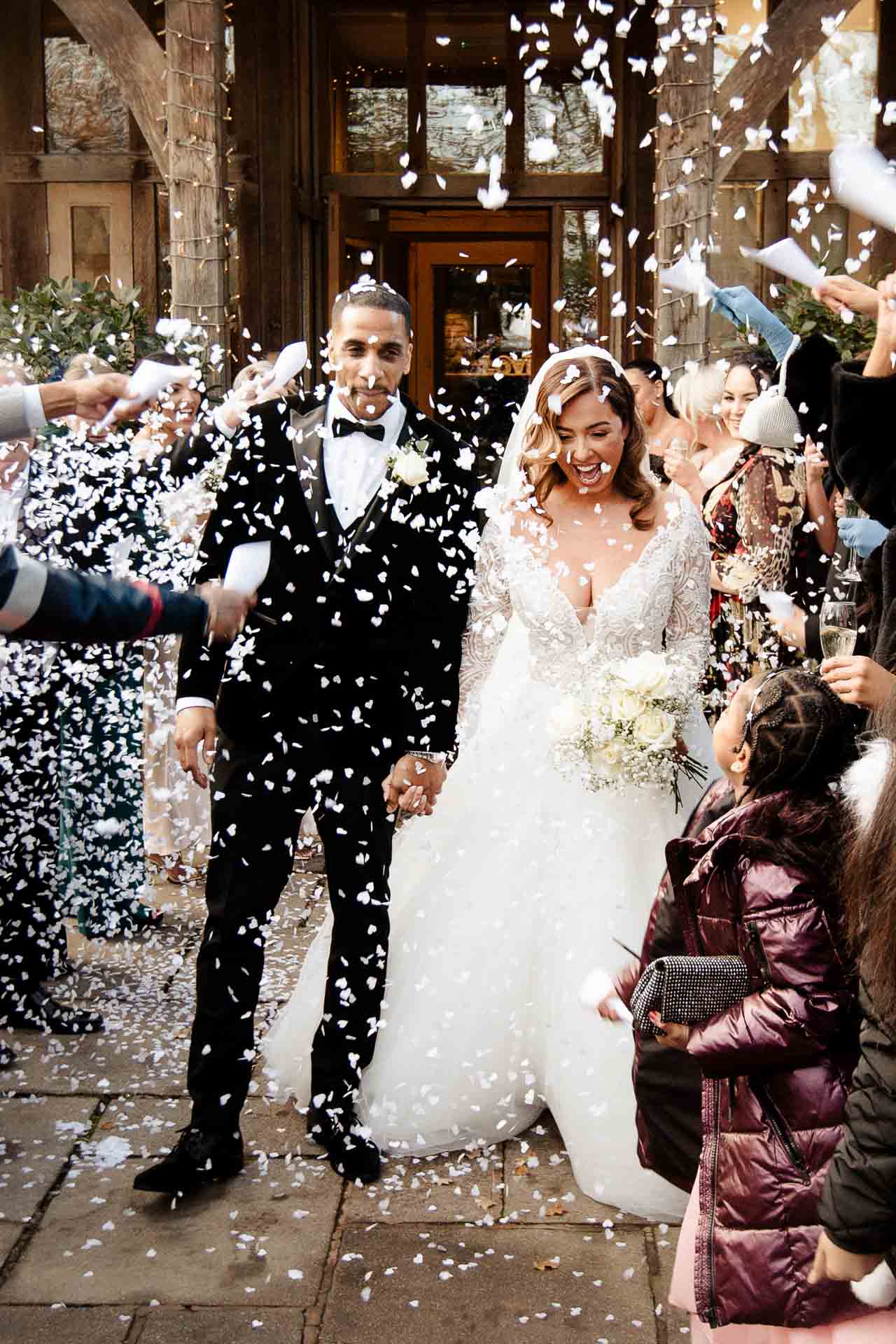 bride and groom portraits at the oak tree peover in the snow winter wedding