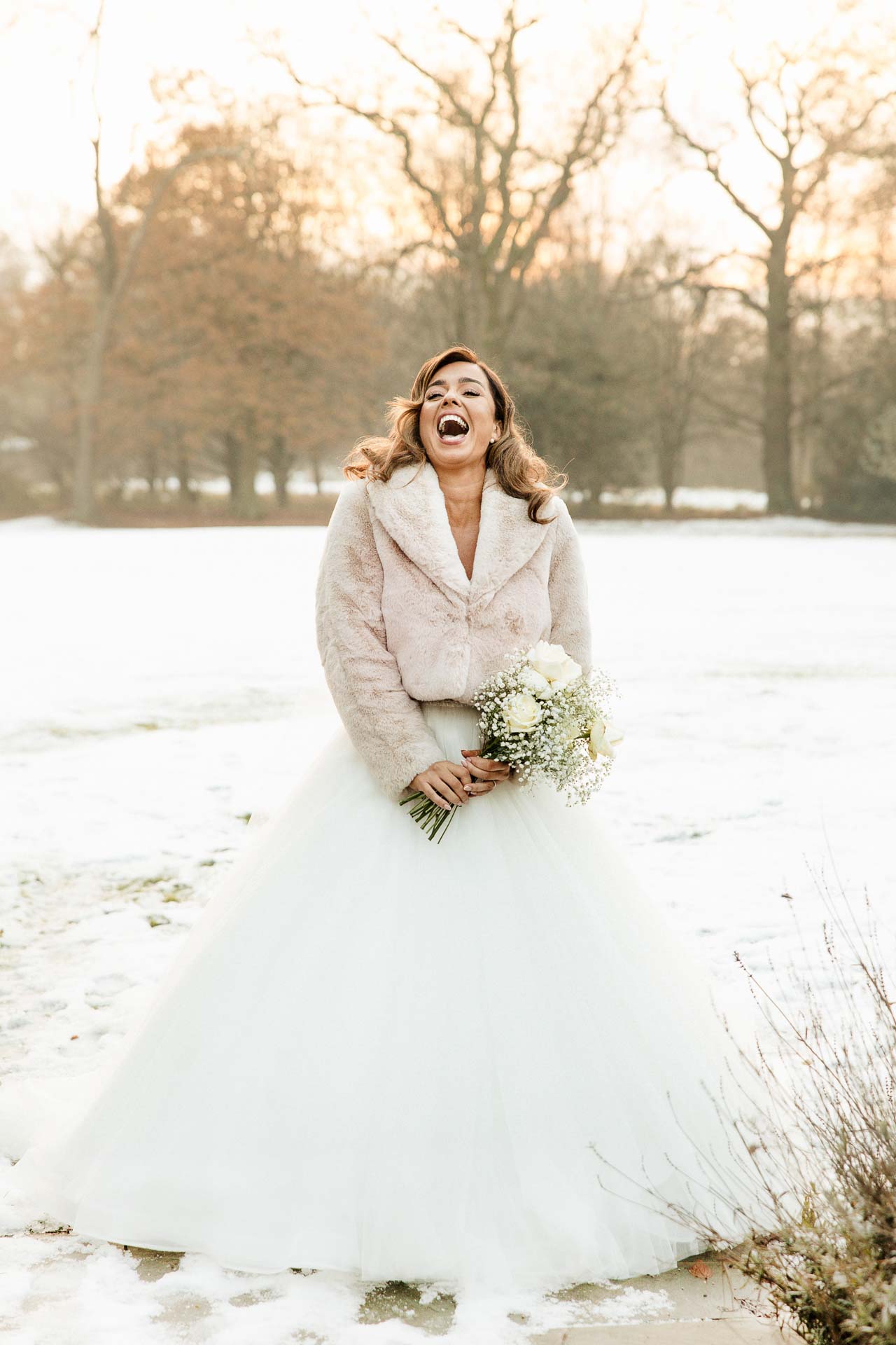 bride and groom portraits at the oak tree peover in the snow winter wedding