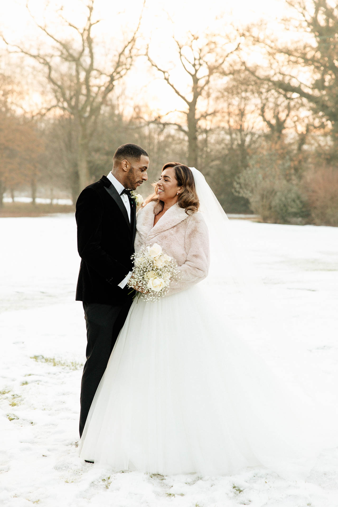 bride and groom portraits at the oak tree peover in the snow winter wedding
