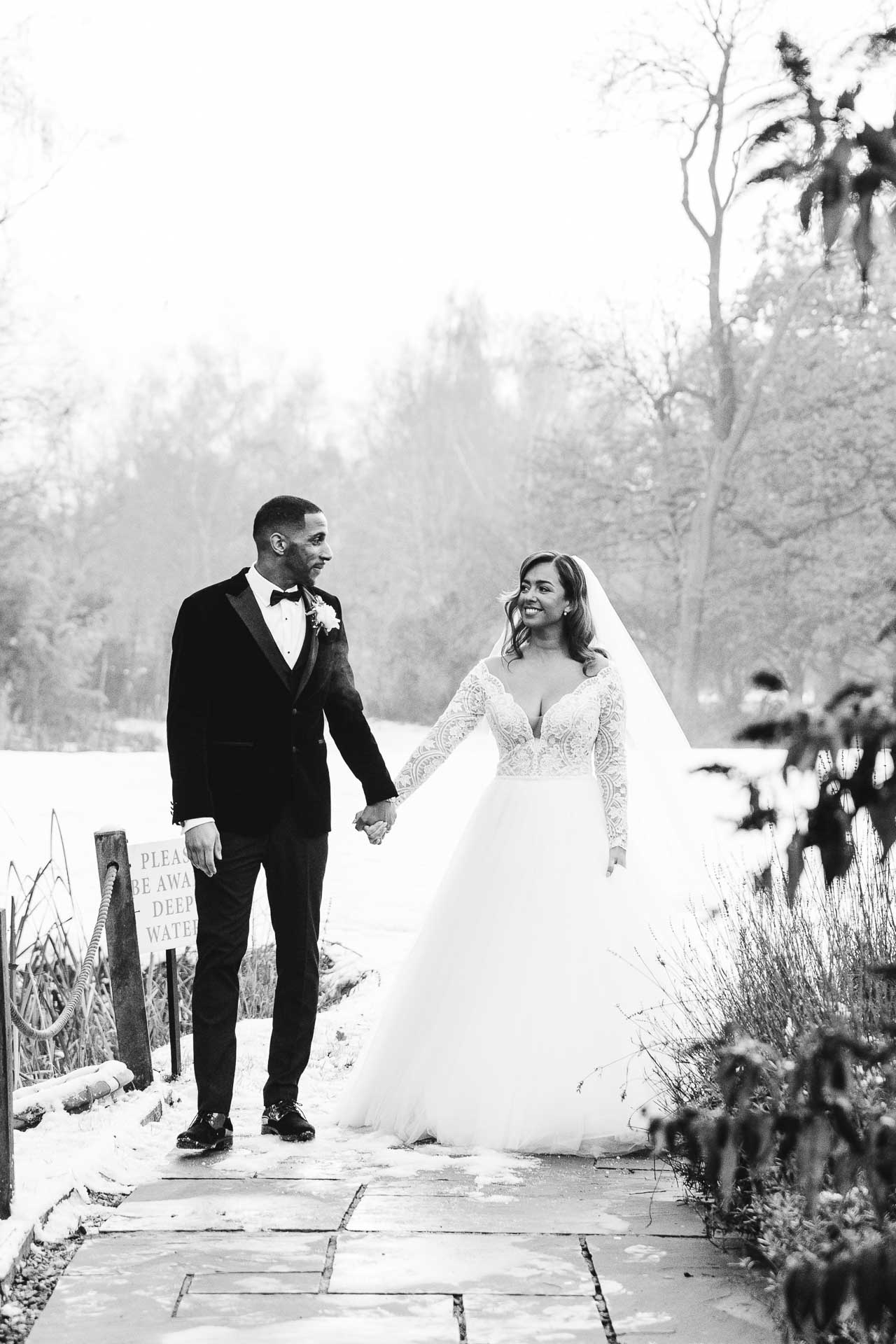 bride and groom portraits at the oak tree peover in the snow winter wedding