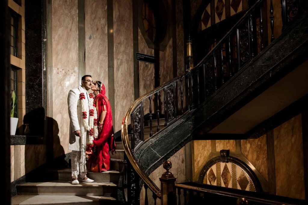 kimpton clock tower a bride and groom on the internal staircase for bridal portraits a lovely manchester city centre wedding venue for larger weddings