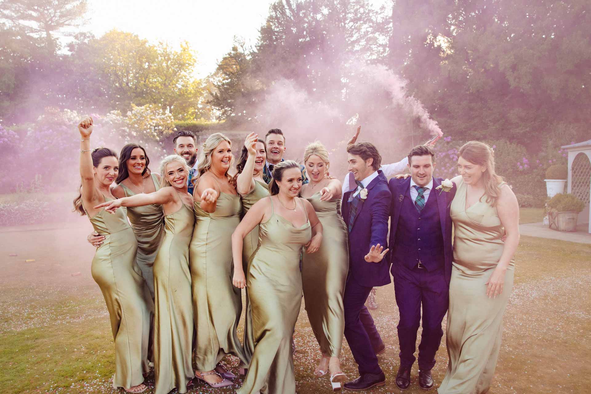 colourful smoke bombs used at eaves hall for the couples wedding photography
