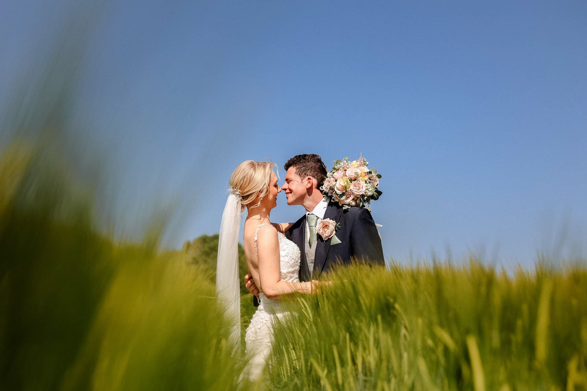 Farm wedding photography for megan and philip on their family farm in August.